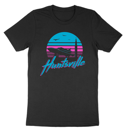 Pathfinder rocket and Saturn V silhouetted against a pink and blue sunrise with "huntsville" text on a black t-shirt