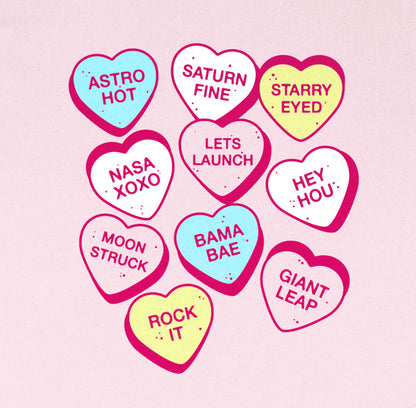 Thumbnail of conversation hearts with "space themed" sayings on pink background