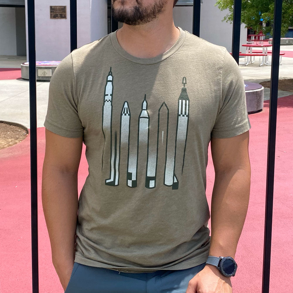 Man wearing a Green T-Shirt with rockets drawn as an optical illusion