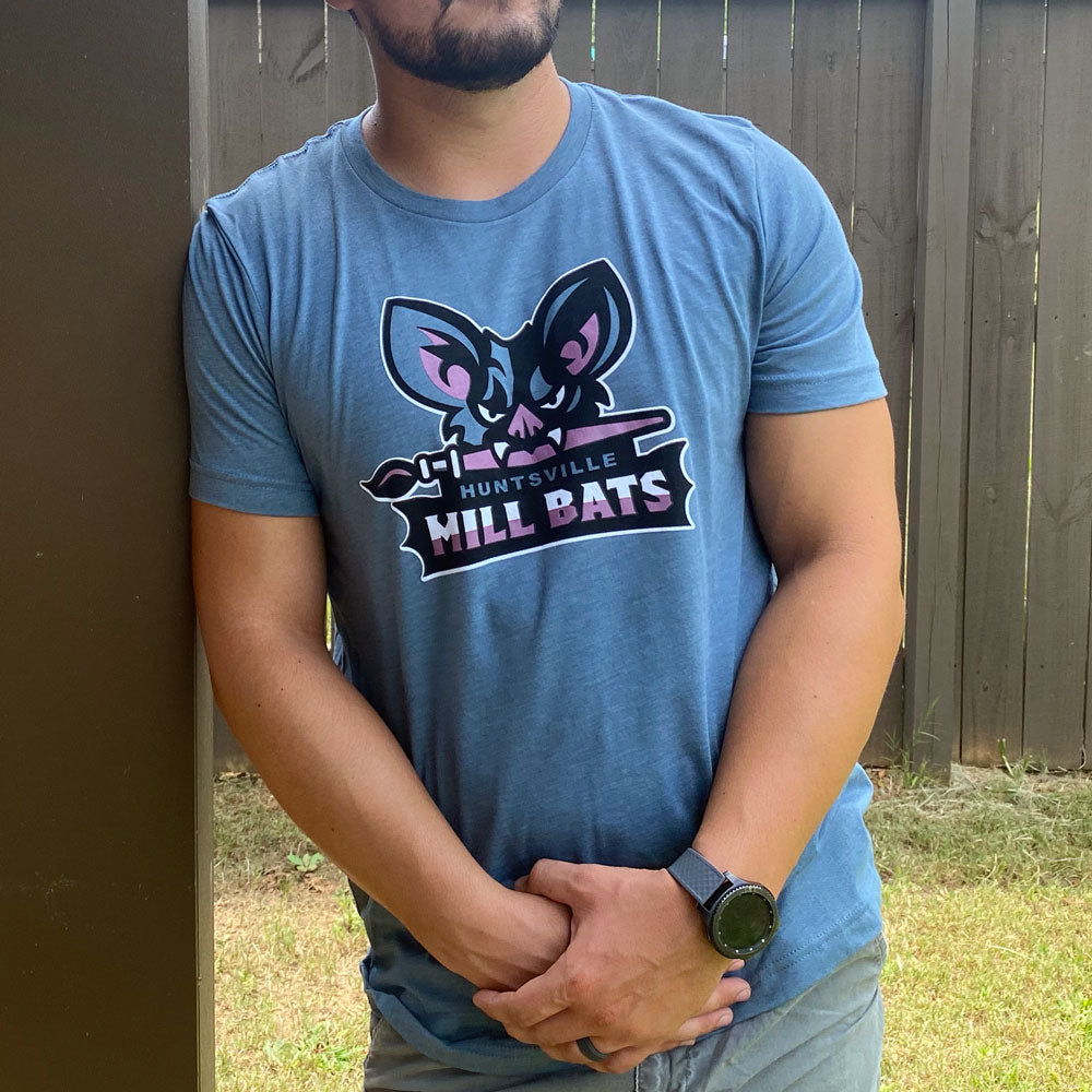 Image of man standing outside wearing Huntsville Mill Bats fantasy baseball logo on heather blue t-shirt