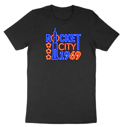 Image of neon lights design with text "Rocket City 1969" on black t-shirt