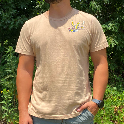 Man wearing shirt with the alabama state bird holding the alabama state flower drawn in american traditional tattoo style
