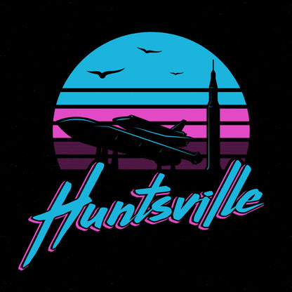 Pathfinder rocket and Saturn V silhouetted against a pink and blue sunrise with "huntsville" text on a black background