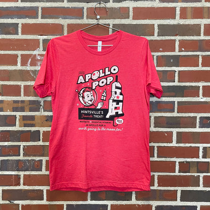 Fun 1960s black and white retro popsicle design on heather red t-shirt hanging against brick wall at Lowe Mill