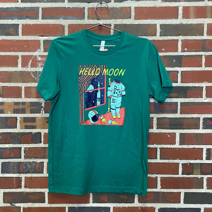 The text "Hello Moon" with an astronaut suit and rocket. In the "goodnight moon" book style on a shirt hanging